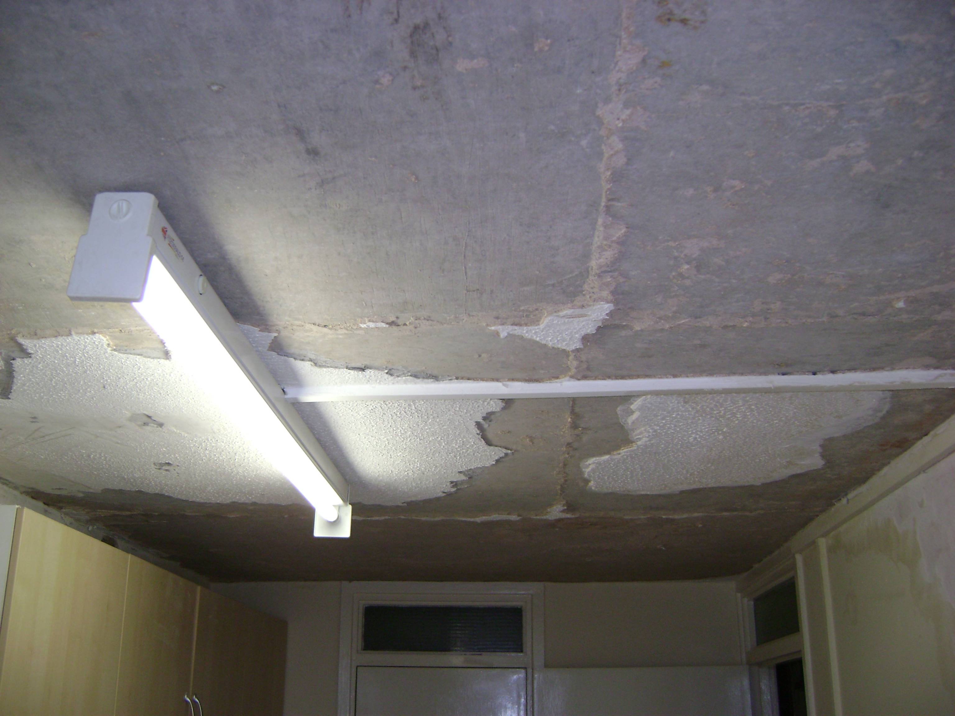 The remaining artex was scraped off in preparation for replastering.